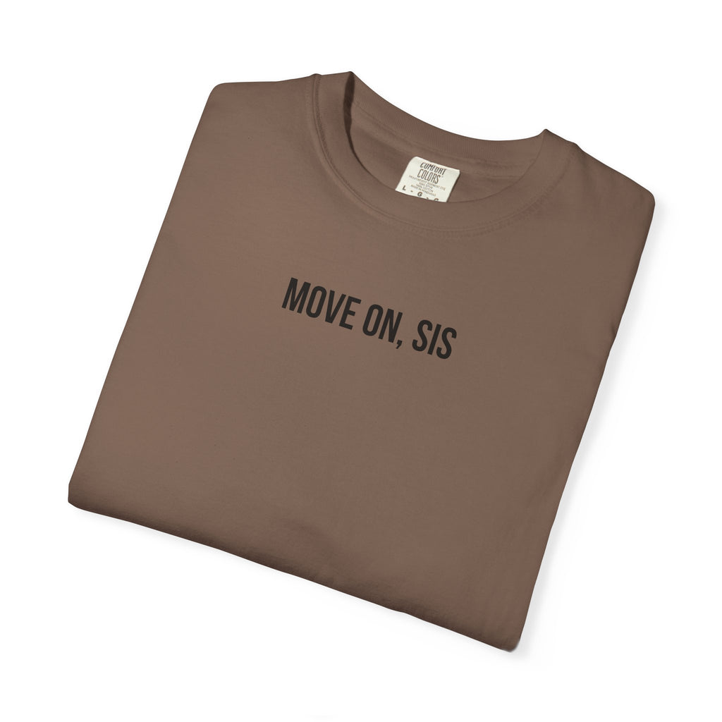 Folded brown t-shirt with 'MOVE ON, SIS' text on a white background